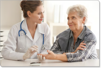 Photo of a female medical worker performing a finger prick on a female patient