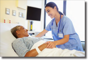 Photo of a nurse tending to a smiling patient in a bed