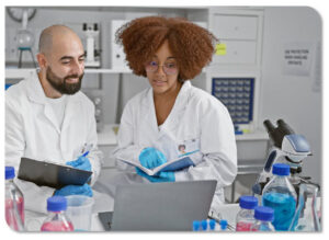 Woman and a man in a laboratory looking at a computer