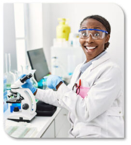 Excited woman pointing at a microscope