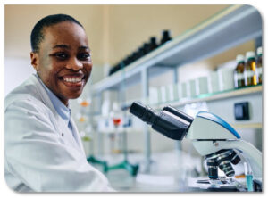 woman using a microscope in lab