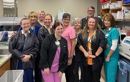 Group photo of staff in laboratory at CNHSA