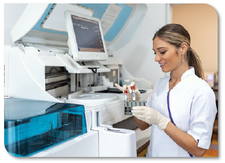 Woman using laboratory analyzer