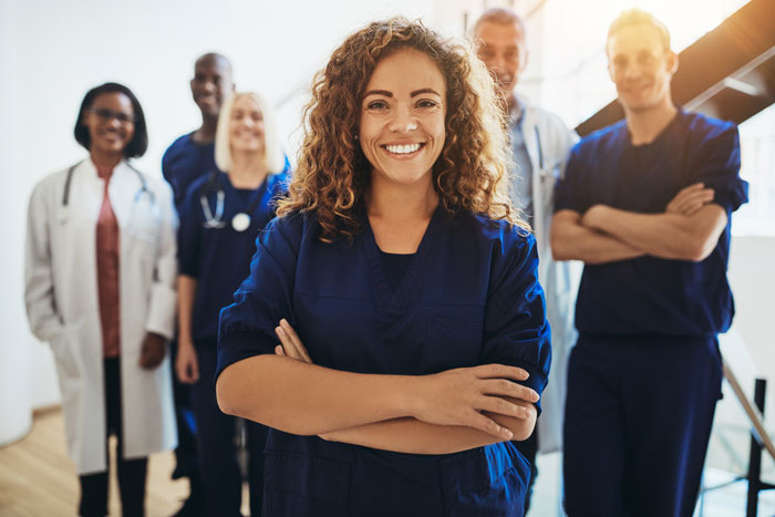 Female doctor smiling while standing